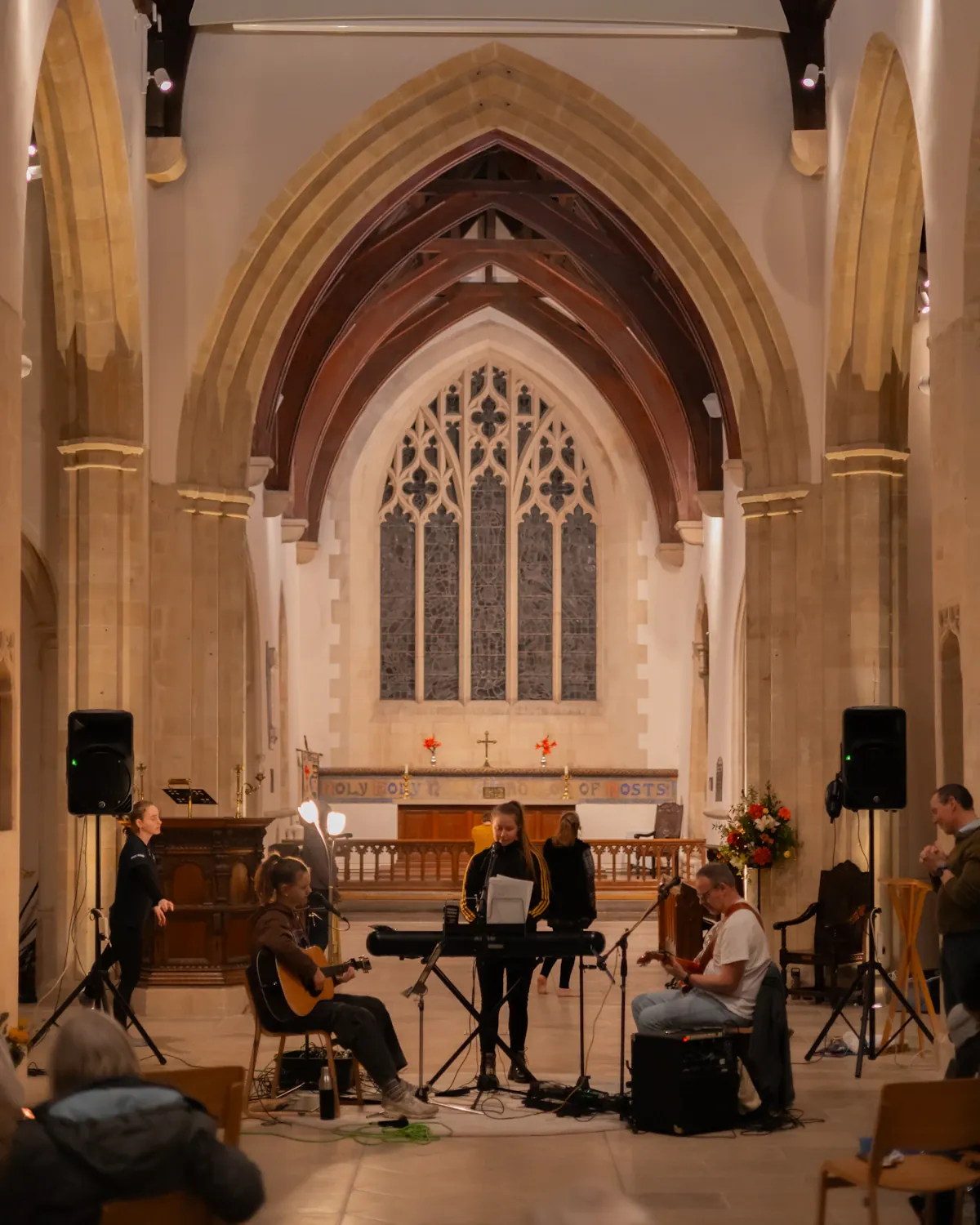 Members of a worship team gathered together behind the scenes.