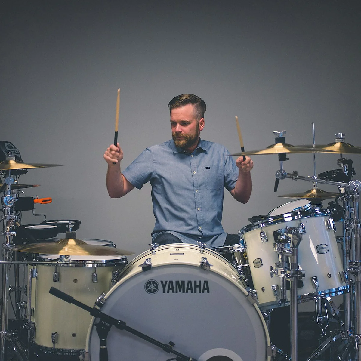 A drummer keeping time during a worship set.